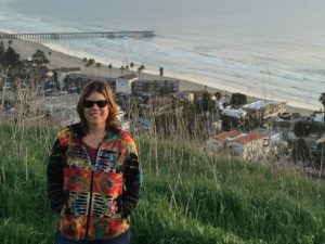 A picture of the author on the top of mountain overlooking the coastline